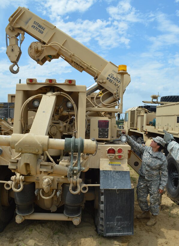 Army Reserve Pfc. Amber B. Quills, of the 751st Quartermaster Company, Petroleum Support, 497th Combat Sustainment Support Battalion, from Bedford, Va., operates a crane attachment while conducting equipment training Warrior Exercise (WAREX) 86-16-03 at Fort McCoy, Wis., July 21, 2016. WAREX is designed to keep Soldiers all across the United States ready to deploy. (U.S. Army photo by Spc. Joseph Driver/Released)