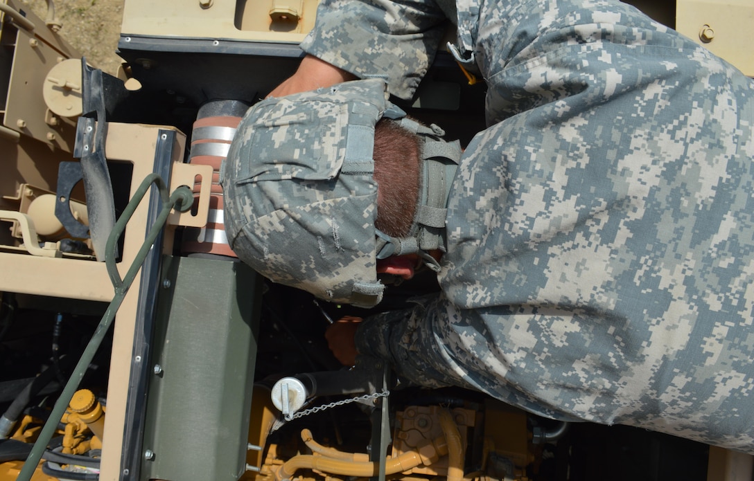 Army Reserve Private Zachary S. Alls, of the 639th Transportation Company, 497th Combat Sustainment Support Battalion, from Bedford, Va., performs maintenance on an M978-A4 Heavy Expanded Mobility Tactical Truck (HEMTT) during Warrior Exercise (WAREX) 86-16-03 at Fort McCoy, Wis., July 21, 2016. WAREX is designed to keep Soldiers all across the United States ready to deploy. (U.S. Army photo by Spc. Joseph Driver/Released)