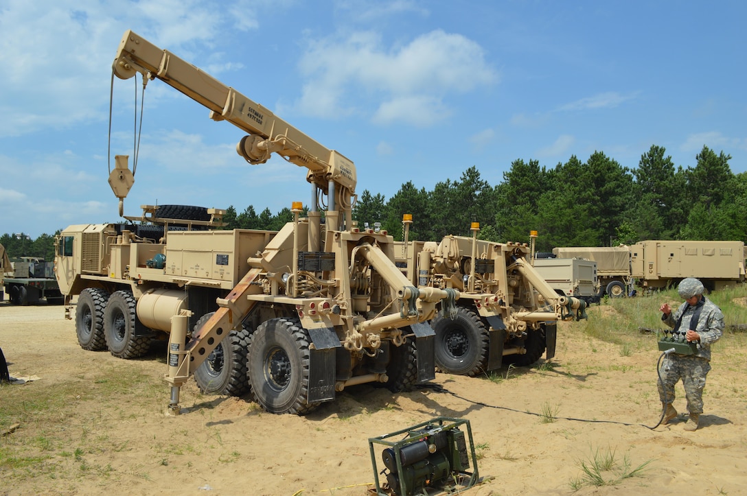 Army Reserve Pfc. Canter J. Lambert-Malcom, of the 639st Quartermaster Company, 497th Combat Sustainment Support Battalion, from Bedford, Va., remote operates a tow crane during Warrior Exercise (WAREX) 86-16-03 at Fort McCoy, Wis., July 21, 2016. WAREX is designed to keep Soldiers all across the United States ready to deploy. (U.S. Army photo by Spc. Joseph Driver/Released)