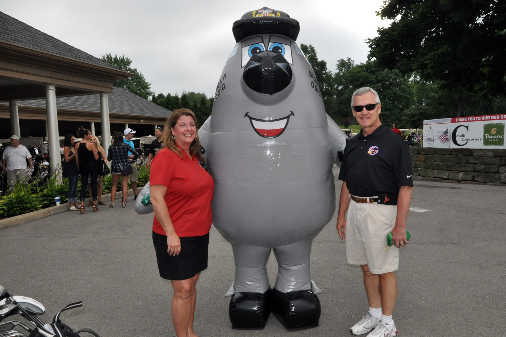 The 910th Airlift Wing's mascot, Winger (center), based at nearby Youngstown Air Reserve Station, Ohio, stands with Youngstown Air Reserve Base Community Council (YARBCC) Charitable Fund Chairperson Lisa Dickson (left) and Honorary Event Chairman Youngstown State University President James Tressel (right) during opening festivities of the 3rd Annual Freedom Warrior Golf Outing and Gala at Squaw Creek Country Club here, July 13, 2016. The mission of the YARBCC Charitable Fund, a 501(c)(3) public charity, is to raise and distribute monies to help support the basic and special needs of disabled and disadvantaged veterans as well as the emergency needs of local military personnel in Ohio’s Mahoning Valley and Pennsylvania’s Shenango Valley. Monies are raised through the annual golf outing event as well as generous donations throughout the year from individuals and organizations. Since August 2014, the fund has granted over $130,000 in grants to individual veterans in need. (Courtesy Photo/Ms. Brenda Rider)   