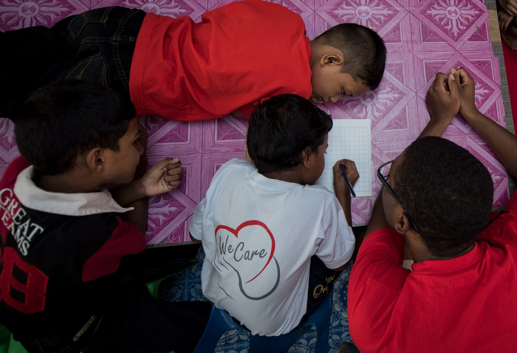 U.S. Air Force Airman 1st Class Lawrence Washington (far right), 35th Aircraft Maintenance squadron spends time with boys from the Shammah Children’s Home, during Cope Taufan 16 in Butterworth, Pulau Pinang, July 23, 2016.  As part of a community relations event during Cope Taufan 16, U.S. Air Force and Royal Malaysian Air Force visited two local orphanages, donated money and provided furniture to children in need. CT 16 is a PACAF-led exercise that reinforces U.S. Pacific Command Theater Security Cooperation goals for the Southeast Asian region and demonstrates U.S. capability to project forces strategically in a combined, joint environment.  More than 450 Airmen are participating, as well as four U.S. Air Force airframes. (U.S. Air Force photo by Tech. Sgt. Araceli Alarcon)