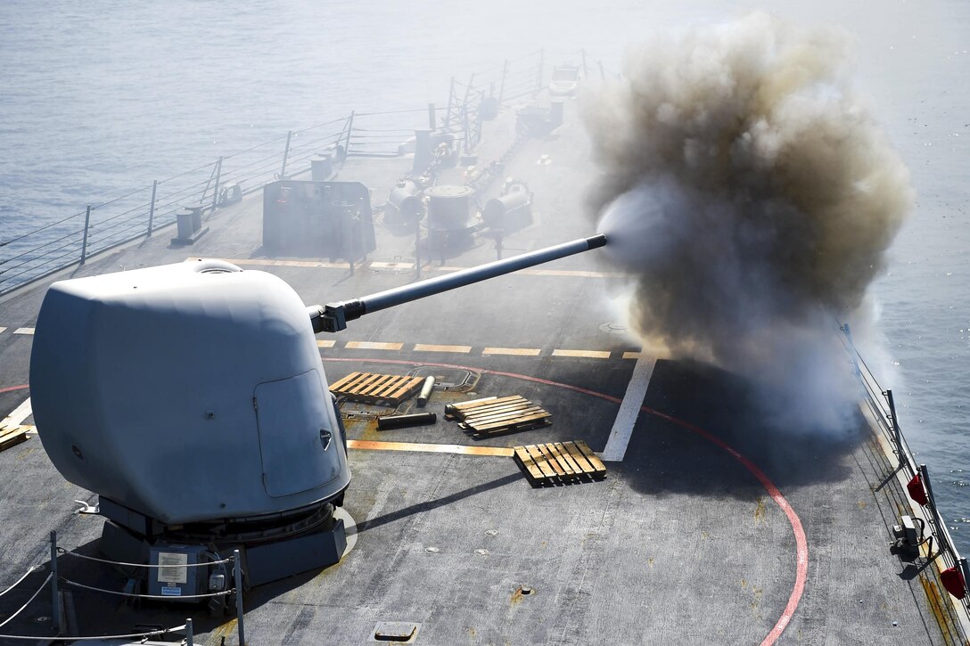 The crew of the USS Stethem fire an MK 45 5-inch lightweight gun at a surface target during Cooperation Afloat Readiness and Training Singapore 2016, or Carat, in the South China Sea, July 24, 2016. The annual maritime exercises occur between the Navy and Marine Corps and the armed forces of nine partner nations, including Bangladesh, Brunei, Cambodia, Indonesia, Malaysia, the Philippines, Singapore, Thailand and Timor-Leste. Navy photo by Petty Officer 1st Class John Pearl