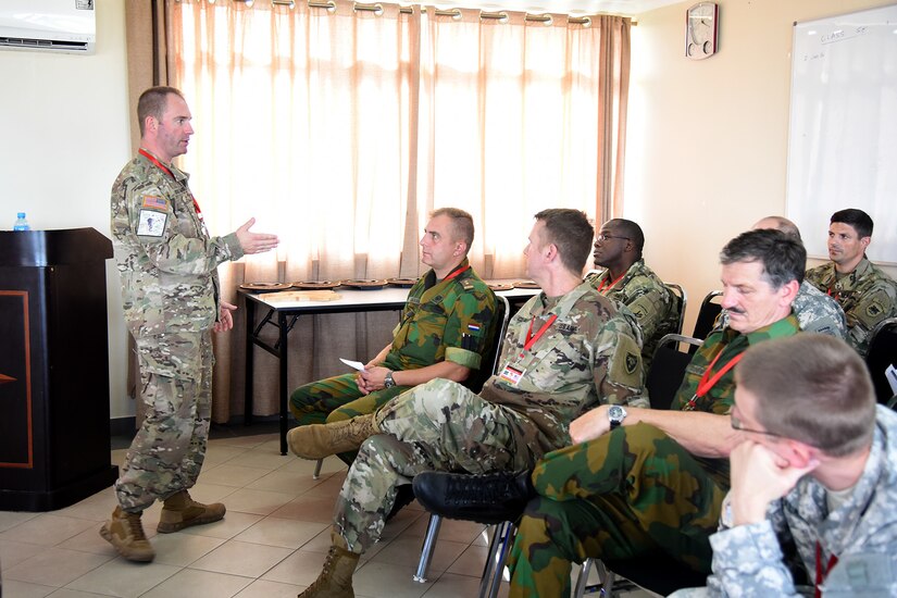 DAR ES SALAAM, Tanzania – U.S. Army Col. Randy Southard, 75th Training Command and Eastern Accord 2016 senior observer controller/trainer, conducts the final after action report with the OC/T team, July 21,2016, at the Tanzanian Peacekeeping Training Centre, in Dar es Salaam, Tanzania. EA16 is an annual, combined, joint military exercise that brings together partner nations to practice and demonstrate proficiency in conducting peacekeeping operations. (U.S. Air Force photo by Staff Sgt. Tiffany DeNault)
