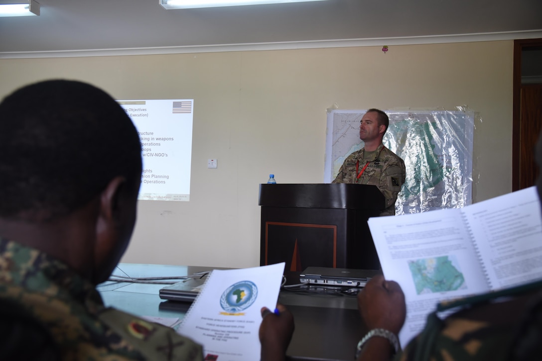 DAR ES SALAAM, Tanzania – U.S. Army Col. Randy Southard, 75th Training Command and Eastern Accord 2016 senior observer controller/trainer, briefs distinguished visitors on the overall layout of the two-week exercise, July 21,2016, at the Tanzanian Peacekeeping Training Centre, in Dar es Salaam, Tanzania. EA16 is an annual, combined, joint military exercise that brings together partner nations to practice and demonstrate proficiency in conducting peacekeeping operations. (U.S. Air Force photo by Staff Sgt. Tiffany DeNault)