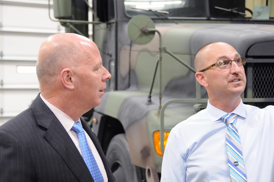 Mr. James Balocki (left), chief executive officer and director of Services and Installations, U.S. Army Reserve, listens as Mr. Gene Scholler, acting chief of staff for the U.S. Army Reserve's 99th Regional Support Command, explains lighting upgrades at Equipment Concentration Site 24 in Fort Indiantown Gap, Pennsylvania. On-site visits like this one allow Balocki to get a better sense of the needs of the civilians who work for the U.S. Army Reserve.