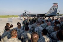 California Air National Guard Maj. Gen. Jon Kelk, both the ANG mobilization assistant to the U.S. Air Forces in Europe/Air Forces Africa commander and the commander, chief of staff of the CANG,  speaks to Airmen assigned to the 194th Expeditionary Fighter Squadron in front of a Massaschusetts Air National Guard F-15C Eagle fighter aircraft assigned to the 104th Fighter Wing, Barnes ANG Base, Mass., during the Romanian air force's 71st Air Base's air show and open house at Campia Turzii, Romania, July 23, 2016. The aviation demonstration took place during the middle of the 194th EFS' six-month long theater security package deployment to Europe in support of Operation Atlantic Resolve, which aims to bolster the U.S.'s continued commitment to the collective security of NATO and dedication to the enduring peace and stability in the region. The unit, comprised of more than 200 CANG Airmen from the 144th Fighter Wing at Fresno ANG Base, Calif., as well as U.S. Air Force Airmen from the 52nd Fighter Wing at Spangdahlem Air Base, Germany, piloted, maintained and supported the deployment of 12 F-15Cs Eagle fighter aircraft throughout nations like Romania, Iceland, the United Kingdom, the Netherlands, Estonia and among others. The F-15Cs took to the skies alongside the 71st AB's MiG-21 fighter aircraft and Puma helicopters for both the airshow, the second engagement of its kind at Campia Turzii under Operation Atlantic Resolve, and the bilateral flight training, also known as Dacian Eagle 2016. The 194th EFS partnered with the 104th EFS's previous deployment as part of the theater security package, including a contingent of 104th FW aircraft which remained at Campia Turzii. (U.S. Air Force photo by Staff Sgt. Joe W. McFadden/Released)