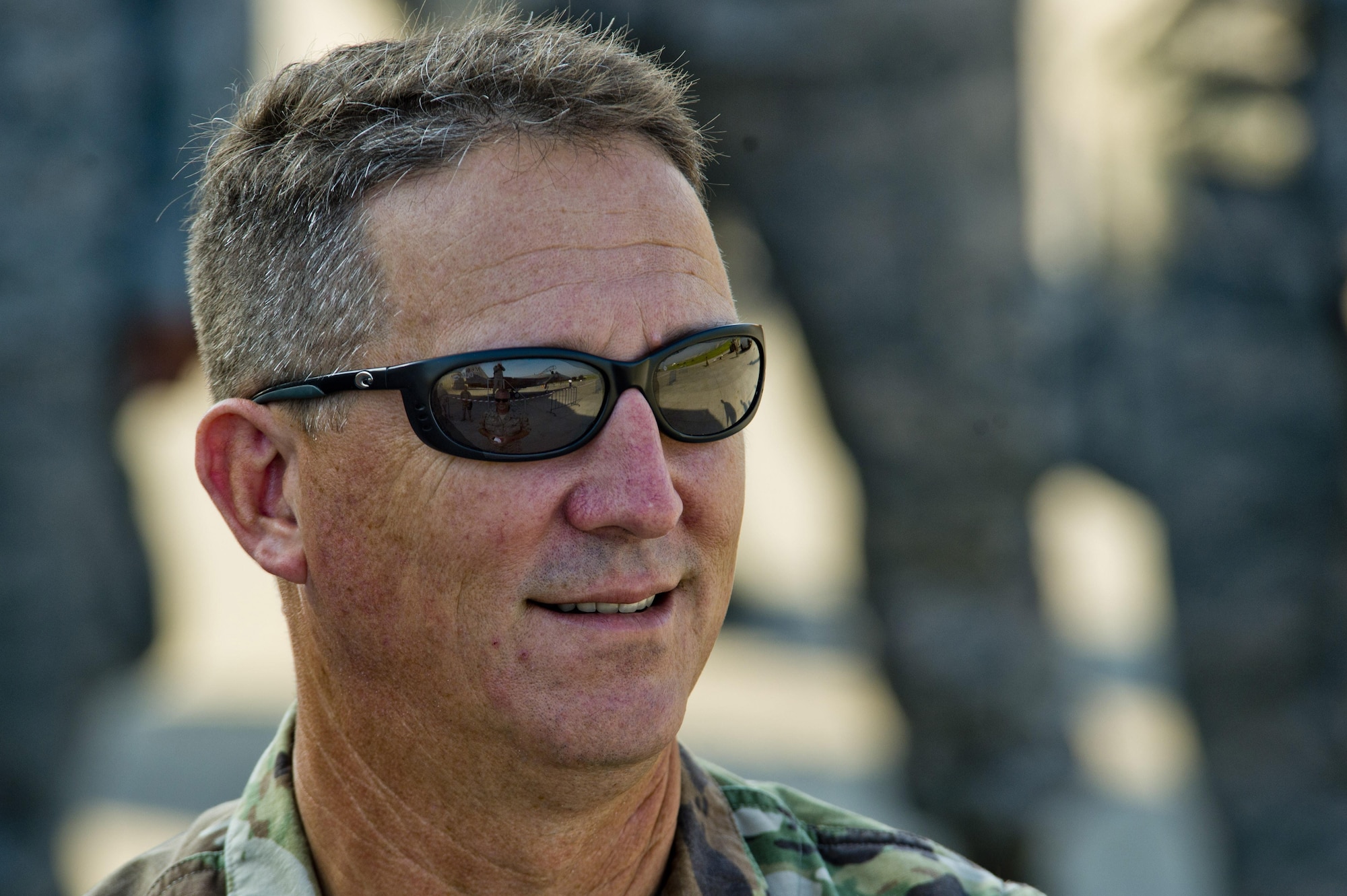 California Army National Guard Maj. Gen. Matthew Beevers, deputy adjutant general of the California Military Department, smiles while receiving a briefing during the Romanian air force's 71st Air Base's air show and open house at Campia Turzii, Romania, July 23, 2016. The aviation demonstration took place during the middle of the U.S. Air Force's 194th Expeditionary Fighter Squadron six-month long theater security package deployment to Europe in support of Operation Atlantic Resolve, which aims to bolster the U.S.'s continued commitment to the collective security of NATO and dedication to the enduring peace and stability in the region. The unit, comprised of more than 200 CANG Airmen from the 144th Fighter Wing at Fresno ANG Base, Calif., as well as U.S. Air Force Airmen from the 52nd Fighter Wing at Spangdahlem Air Base, Germany, piloted, maintained and supported the deployment of 12 F-15Cs Eagle fighter aircraft throughout nations like Romania, Iceland, the United Kingdom, the Netherlands, Estonia and among others. The F-15Cs took to the skies alongside the 71st AB's MiG-21 fighter aircraft and Puma helicopters for both the airshow, the second engagement of its kind at Campia Turzii under Operation Atlantic Resolve, and the bilateral flight training, also known as Dacian Eagle 2016. (U.S. Air Force photo by Staff Sgt. Joe W. McFadden/Released)