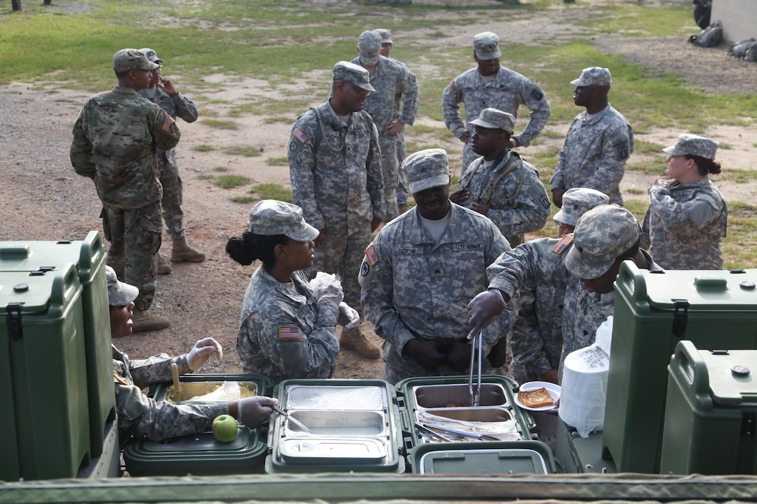 U.S. Army Soldiers of the 982nd Combat Camera Company Airborne, stand in line for hot chow during weapons qualification for Battle Training Assembly on Fort Bragg, NC July 16, 2016.  Weapons qualifcation is a mandatory training requirement that is part of the statutory obligation when assigned to the U.S. Army Reserves. (U.S. Army photo by Spc. Jesse Artis/Released)