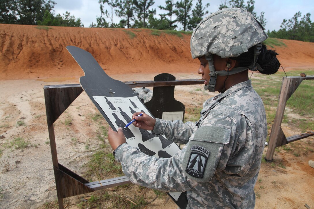 U.S. Army Spc. Zakia Gray, assigned to 982nd Combat Camera Company Airborne, counts her target during weapon qualifications for her Battle Training Assembly on Fort Bragg, NC July 16, 2016.  Weapons qualifcation is a mandatory training requirement that is part of the statutory obligation when assigned to the U.S. Army Reserves. (U.S. Army photo by Spc. Jesse Artis/Released)