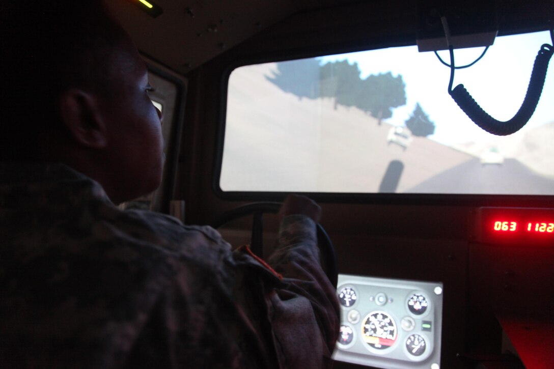 U.S. Army Kenedi Wilkes, assigned to the 982nd Combat Camera, simulates driving the High Mobility Multipurpose Wheeled Vehicle during convoy training for annual training at Fort Bragg, NC on July 18, 2016. AT is a mandatory training requirement that is part of the statutory obligation when assigned to the U.S. Army Reserves. (U.S. Army photo by Spc. Lisa Velazco/Released)