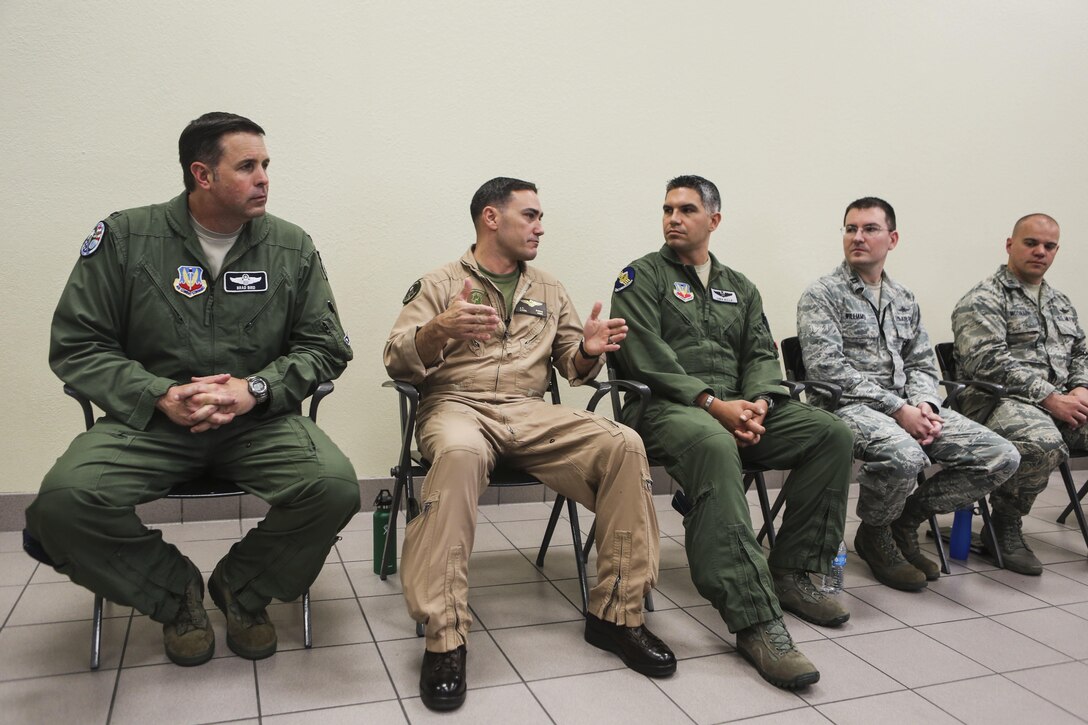 Lt. Col. J.T. Bardo, second from left, commanding officer of Marine Fighter Attack Squadron (VMFA) 121, answers questions about the F-35B Lightning II participating in exercise Red Flag 16-3 at Nellis Air Force Base, Nev., July 20. This is the first time that the fifth generation fighter has participated in the multiservice air-to-air combat training exercise. (U.S. Marine Corps photo by Lance Cpl. Harley Robinson/Released)
