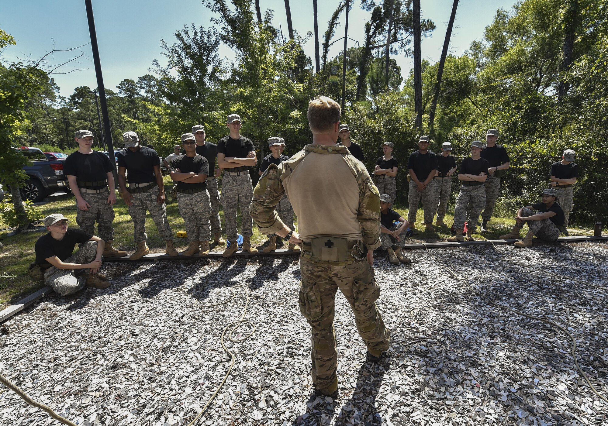 A Special Tactics Training Squadron instructor speaks to local Junior ROTC cadets during a rappel-safety briefing at Hurlburt Field, Fla., July 20, 2016. Special Tactics Airmen partnered with 60 cadets from five local high schools for a week-long Summer Leadership Course, teaching leadership, teamwork and self-confidence. (U.S. Air Force photo by Senior Airman Ryan Conroy) 