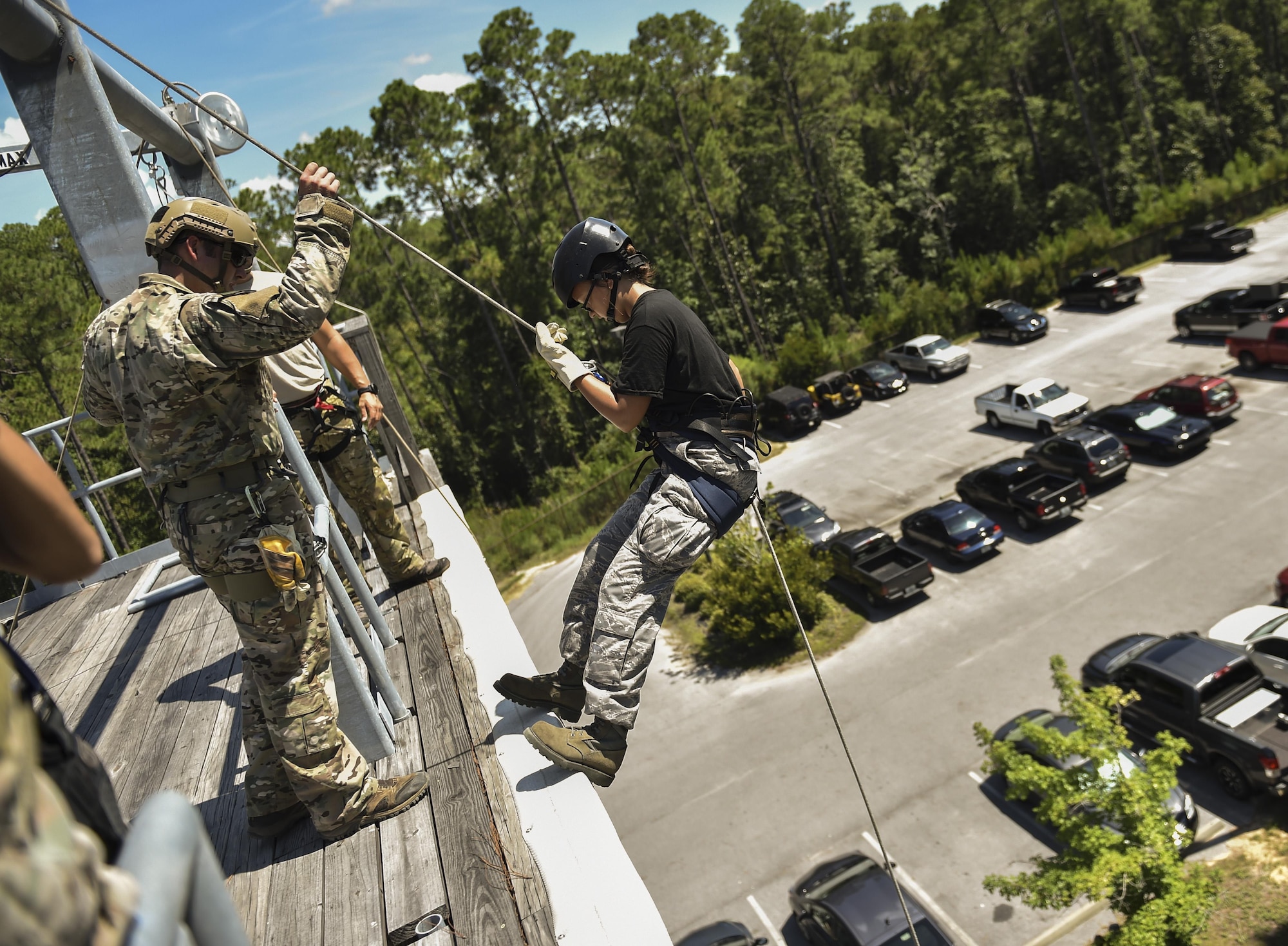 Junior ROTC cadets rappel down a 40-foot tower normally used for training on rescue and infiltration techniques at Hurlburt Field, Fla., July 20, 2016. Special Tactics Airmen partnered with 60 cadets from five local high schools for a week-long Summer Leadership Course, teaching leadership, teamwork and self-confidence. (U.S. Air Force photo by Senior Airman Ryan Conroy)