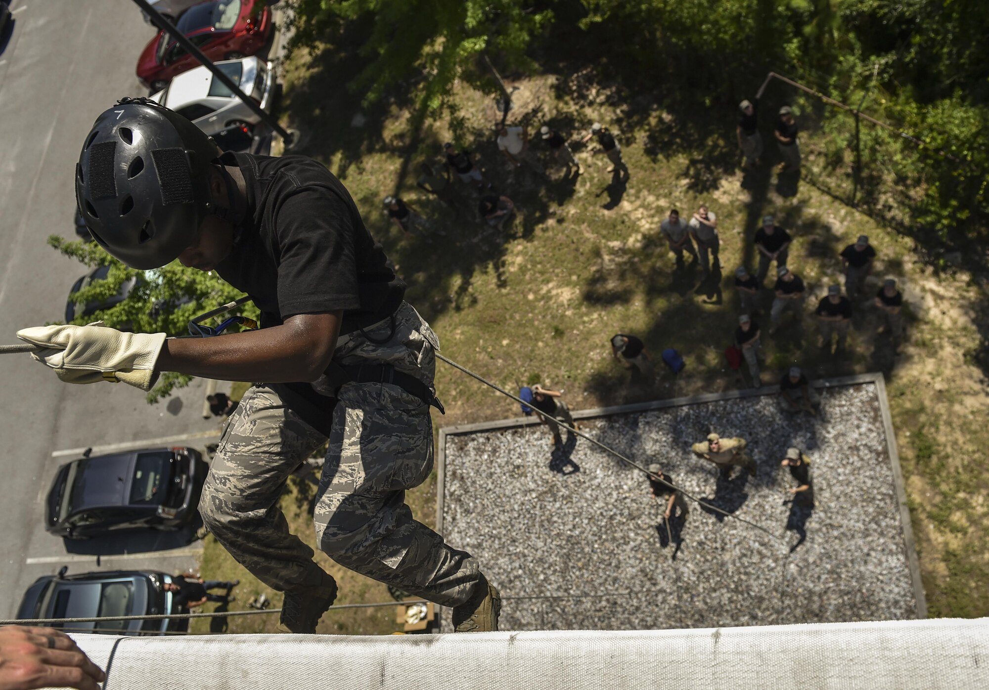 Junior ROTC cadets rappel down a 40-foot tower normally used for training on rescue and infiltration techniques at Hurlburt Field, Fla., July 20, 2016. Special Tactics Airmen partnered with 60 cadets from five local high schools for a week-long Summer Leadership Course, teaching leadership, teamwork and self-confidence. (U.S. Air Force photo by Senior Airman Ryan Conroy)