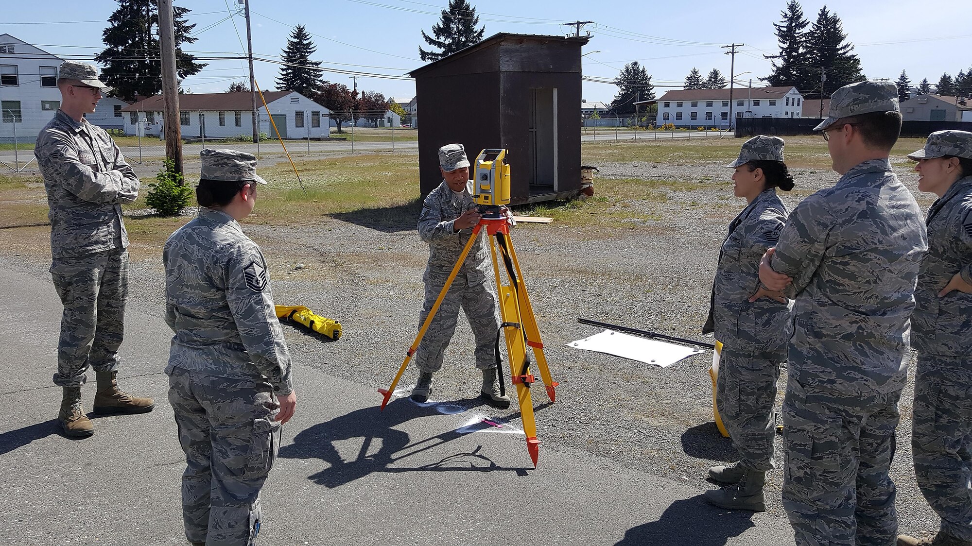 Air Force Reservists from the 446th Civil Engineer Squadron and Washington Air National Guardsmen from the 248th Civil Engineer Flight operate surveying equipment May 1, 2016, at Camp Murray, Wash. The two-day training event provided hands-on training that covered the introduction of essential computer programs and surveying equipment. (Courtesy Photo)