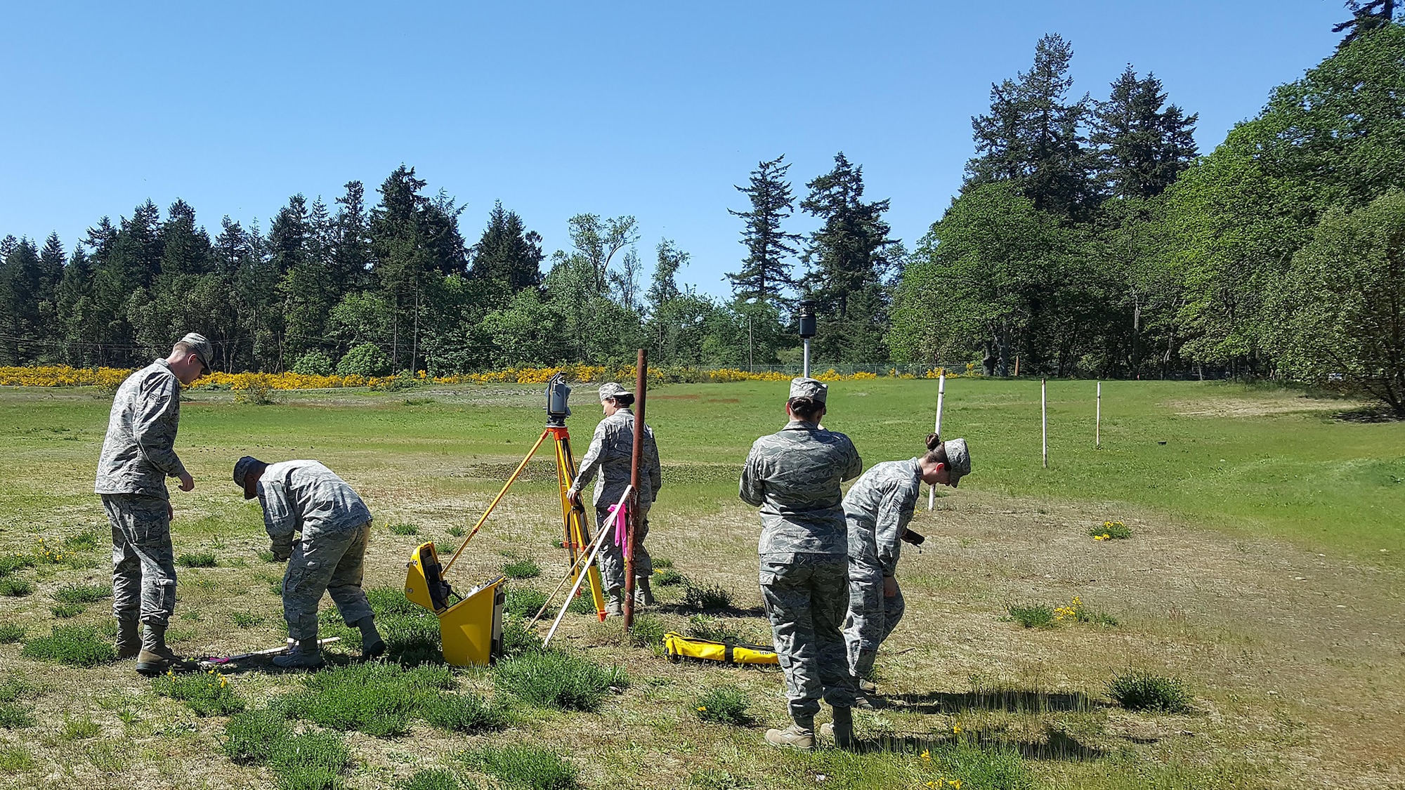 Air Force Reservists from the 446th Civil Engineer Squadron and Washington Air National Guardsmen from the 248th Civil Engineer Flight operate surveying equipment May 1, 2016, at Camp Murray, Wash. The two-day training event provided hands-on training that covered the introduction of essential computer programs and surveying equipment.  (Courtesy Photo)