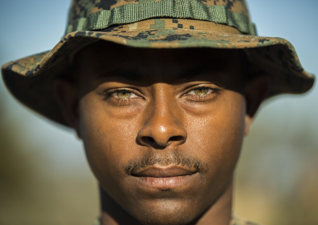 U.S. Marine Sgt. Jobie Mayo poses for a picture at Pohakuloa Training Area, Hawaii, July 14, 2016. Mayo’s current duty station is Okinawa, but he is currently on Hawaii participating in Rim of the Pacific 2016, a multinational military exercise, form June 29 to Aug. 8 in and around Hawaiian Islands. Mayo, a native of Detroit, is a radio operator with 5th Air Naval Gunfire Liaison Company, III Marine Expeditionary Force. The Marines of III MEF travel year-round throughout the Pacific, building partnerships with regional allies and training to quickly respond to any crisis that may arise. (U.S. Marine Corps photo by Cpl. Isaac Ibarra)