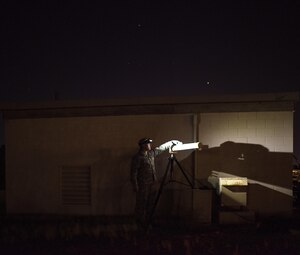 Capt. Brian Goodman, 527th Space Aggressor Squadron flasher flight commander prepares a device moments before testing a fighter squadron's GPS capability without the squadron knowing, July 21, 2016 at Nellis Air Force Base, Nevada, during exercise Red Flag. “We are presenting them problem sets that they have to critically think through, develop solutions for and go out there and execute them,” Goodman said.  (U.S. Air Force photo/Tech. Sgt. David Salanitri)