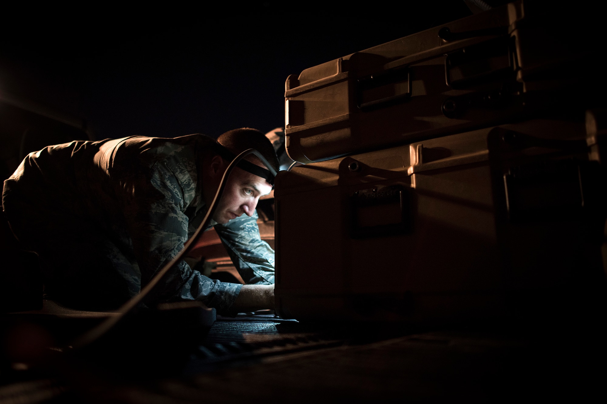 Capt. Brian Goodman, 527th Space Aggressor Squadron, ensures equipment is ready before a mission to disrupt a unit's space capabilities during exercise Red Flag, July 21, 2016 at Nellis Air Force Base, Nevada. Red Flag 16-3 is aimed at teaching service members how to integrate air, space and cyberspace elements. (U.S. Air Force photo/Tech. Sgt. David Salanitri)