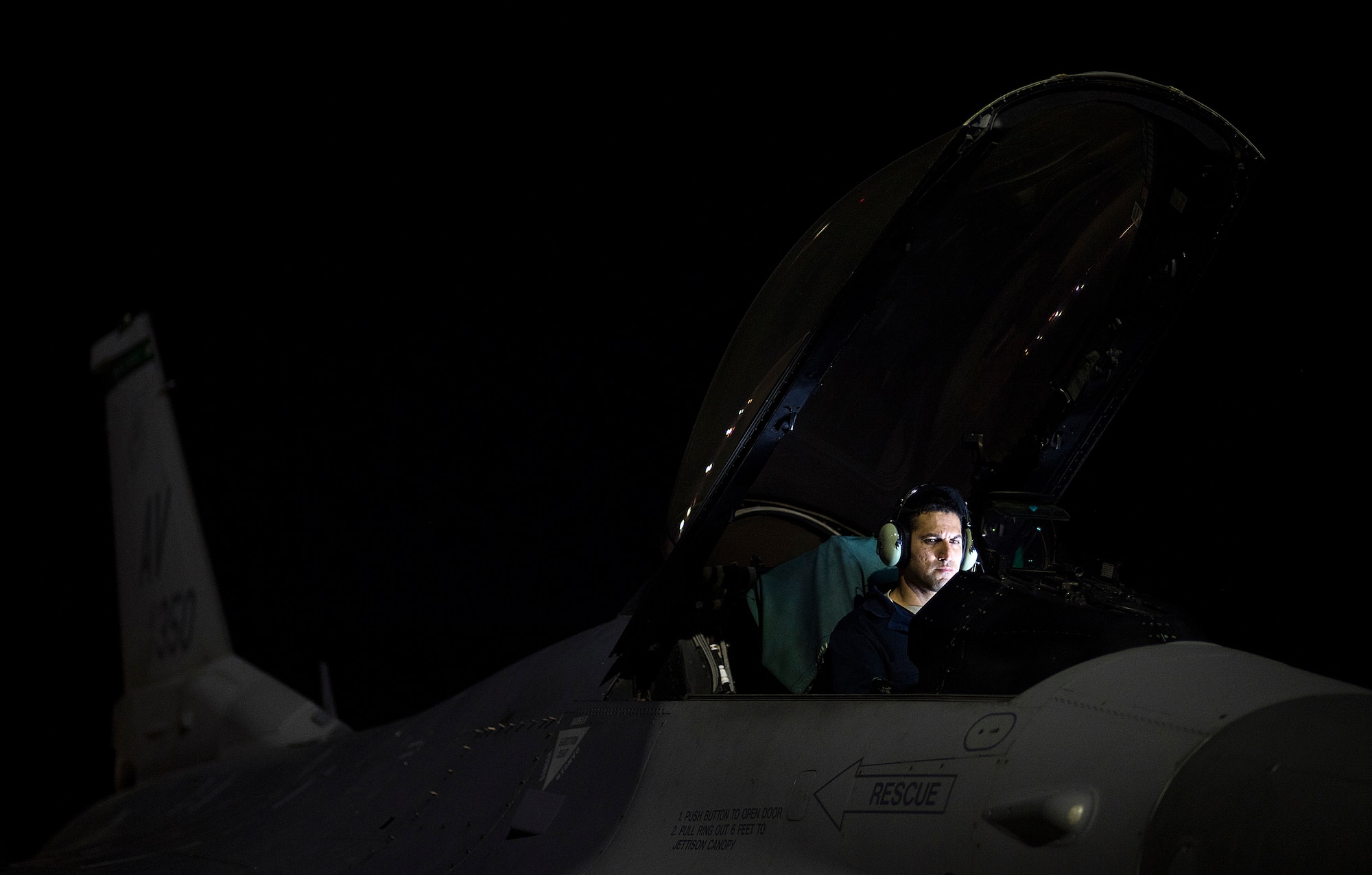Staff Sgt. Erick Vega, an avionics specialist with the 555th Fighter Squadron out of Aviano Air Base, Italy, attempts to determine if his equipment is failing, or if the space systems aboard the F-16 Fighting Falcon is being attacked by simulated enemy forces through space warfare during exercise Red Flag at Nellis Air Force Base, Nevada, July 21, 2016. Red Flag 16-3 is aimed at teaching service members how to integrate air, space and cyberspace elements. (U.S. Air Force photo/Tech. Sgt. David Salanitri)