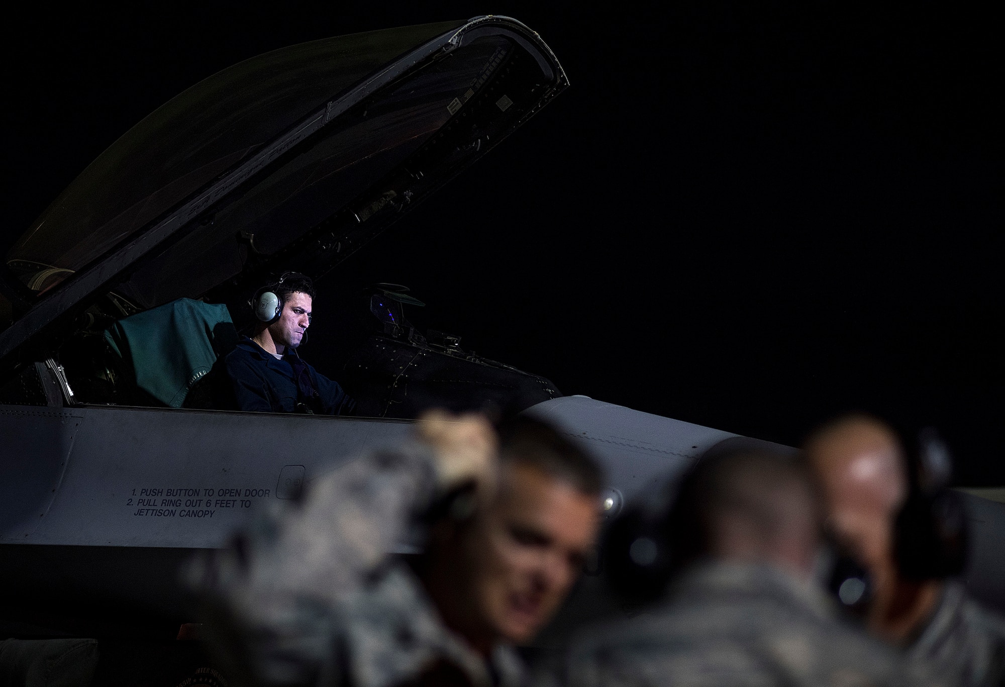 From the left, Staff Sgt. Erick Vega, an avionics specialist with the 555th Fighter Squadron out of Aviano Air Base, Italy, shows a look of frustration nearly an hour after encountering degraded space operations to his F-16 Fighting Falcon on Nellis Air Force Base, Nevada July 21, 2016 during exercise Red Flag. “During the exercise, they see the enemy effects. They can apply what they learned from us and overcome what we are doing,” said Senior Master Sgt. Thomas Arns, 527 Space Aggressor Squadron (U.S. Air Force photo/Tech. Sgt. David Salanitri)