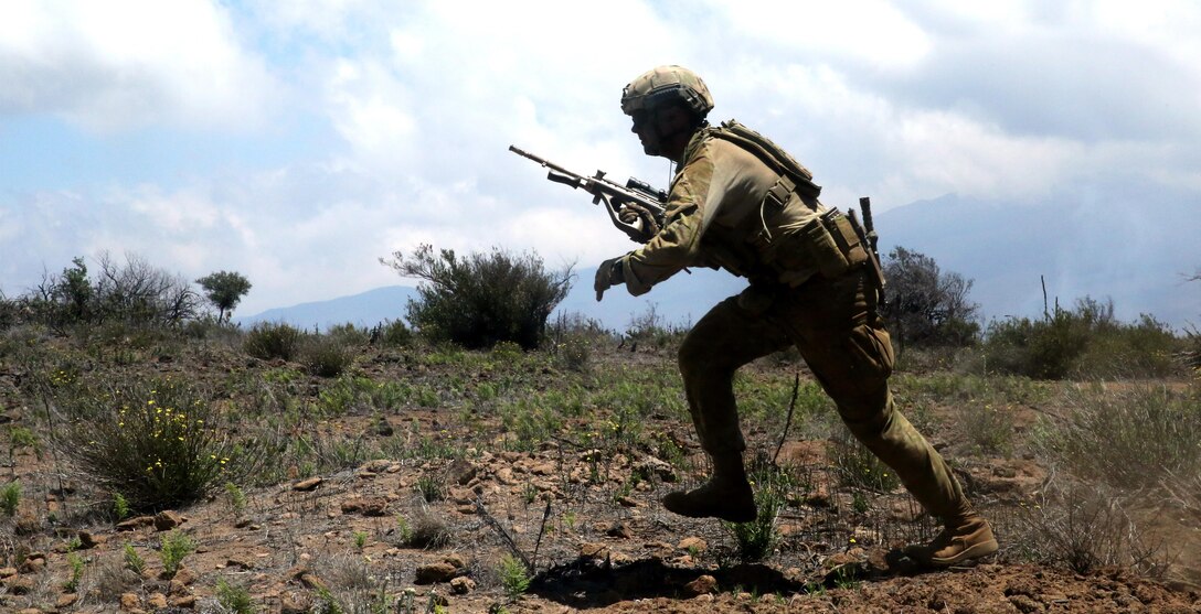 An Australian soldier runs for cover during a squad fire and maneuver exercise at Pohakuloa Training Area, Hawaii, July 14, 2016. The soldiers are participating in Rim of the Pacific 2016, a multinational military exercise, from June 29 to Aug. 4 in and around the Hawaiian Islands. RIMPAC gives U.S. service members an opportunity to interact with partners and allies in the Pacific region. (U.S. Marine Corps Photo by Cpl. Natalie A. Dillon)