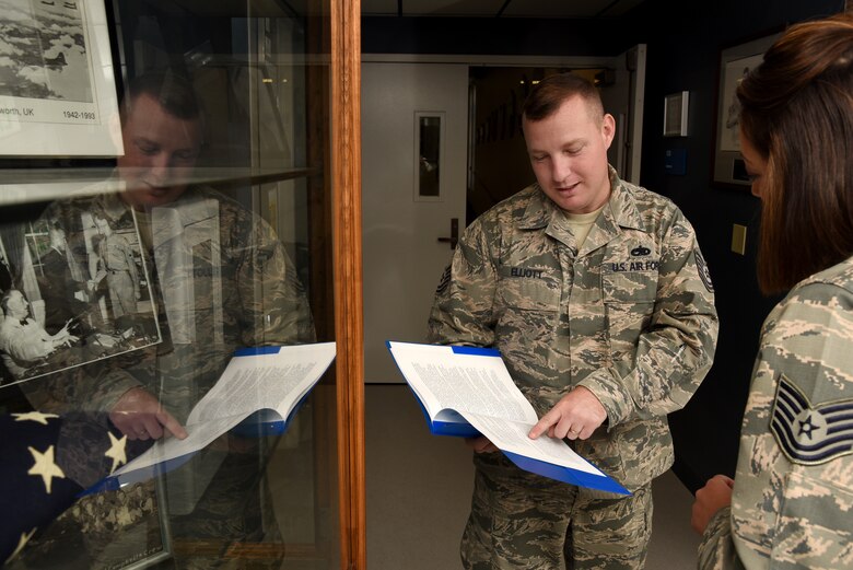 Tech. Sgt. Alex Elliott, Forrest L. Vosler Noncommissioned Officer Academy flight instructor, coordinates lesson plans with another flight instructor at Peterson Air Force Base, Colo., July 20, 2016. In the past few months he completed a master’s degree in criminal justice, was selected for promotion to master sergeant and picked up for Officer Training School. (U.S. Air Force photo by Airman 1st Class Dennis Hoffman)