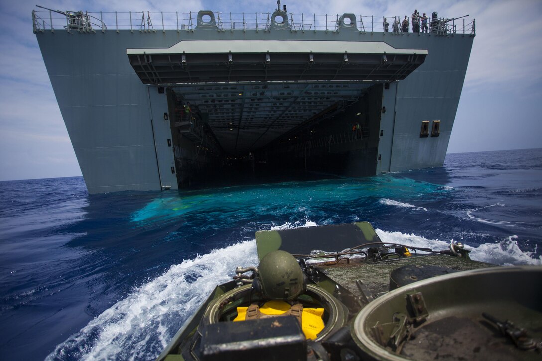 Lance Cpl. Ryley Sweet drives an assault amphibious vehicle from amphibious assault ship USS San Diego to HMAS Canberra, July 18, 2016, off the coast of Hawaii. The Marines are participating in the Rim of the Pacific 2016, a multinational military exercise, from June 29 to Aug. 8 in and around the Hawaiian Islands. Participation in RIMPAC will help us develop mutual trust and respect across the joint and combined team through increased understanding of allied and partner cultures, competencies, and capabilities. Sweet is an assault amphibious vehicle driver with Combat Assault Company, 3rd Marine Regiment, and a native of Kansas City, Missouri.