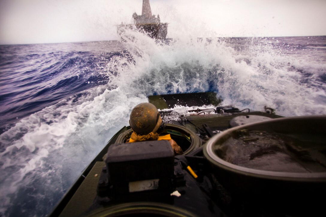 Lance Cpl. Ryley Sweet drives an assault amphibious vehicle onto amphibious assault ship USS San Diego, off the coast of Hawaii, July 18, 2016. The Marines are participating in the Rim of the Pacific 2016, a multinational military exercise, from June 29 to Aug. 8 in and around the Hawaiian Islands. Participation in RIMPAC will help us develop mutual trust and respect across the joint and combined team through increased understanding of allied and partner cultures, competencies, and capabilities. Sweet, an assault amphibious vehicle driver with Combat Assault Company, 3rd Marine Regiment, which supports III Marine Expeditionary Force, is a native of Kansas City, Missouri.