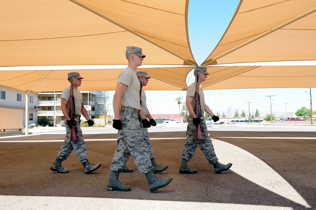 The honor guardsmen at Luke Air Force Base practice firing party movements July 7, 2016.  Firing party is performed with three volleys of fire, equaling up to nine shots. 