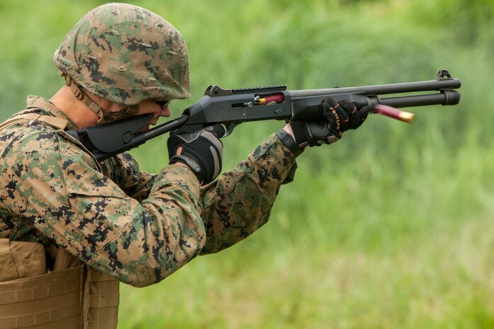 A combat engineer with Marine Wing Support Squadron (MWSS) 171 stationed at Marine Corps Air Station Iwakuni, Japan, shoots a Benelli M4 Super 90 shotgun while conducting familiarization training during exercise Eagle Wrath 2016 at Combined Arms Training Center Camp Fuji, July 20, 2016. The squadron plans to complete their unit annual training requirements throughout three stages, which focus on air base ground defense and Marine Corps common skills that Marines are unable to train for locally. Combat engineers within the squadron also conducted training for Military Operations in Urban Terrain, which focuses on improving the individual and collective combat skills of the Marines. (U.S. Marine Corps photo by Lance Cpl. Aaron Henson)