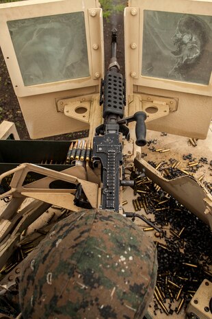 A U.S. Marine with motor transportation company, Marine Wing Support Squadron (MWSS) 171 stationed at Marine Corps Air Station Iwakuni, Japan, shoots an M240 bravo light-machine gun while conducting company level training during exercise Eagle Wrath 2016 at Combined Arms Training Center Camp Fuji, July 20, 2016. The squadron plans to complete their unit annual training requirements throughout three stages, which focus on air base ground defense and Marine Corps common skills that Marines are unable to train for locally. During this training, the company commanders have the opportunity to train their personnel and prepare for the final culminating event where Marines will construct and defend a landing zone and refueling point. (U.S. Marine Corps photo by Lance Cpl. Aaron Henson)