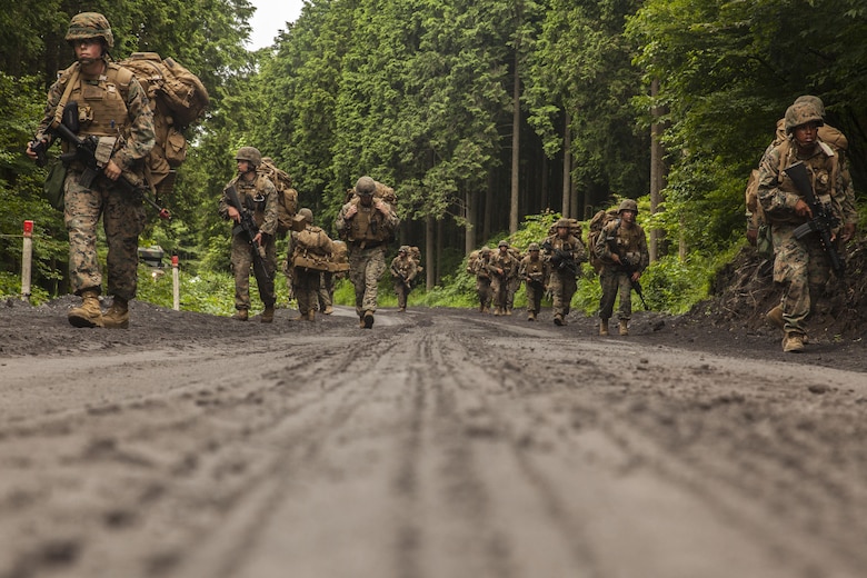 U.S. Marines with Fuels platoon and Headquarters and Service Company, Marine Wing Support Squadron (MWSS) 171 stationed at Marine Corps Air Station Iwakuni, Japan, conduct a patrol as part of their company level training during exercise Eagle Wrath 2016 at Combined Arms Training Center Camp Fuji, July 21, 2016. During this training, the company commanders have the opportunity to train their personnel and prepare for the final culminating event where Marines will construct and defend a landing zone and refueling point. (U.S. Marine Corps photo by Lance Cpl. Aaron Henson)