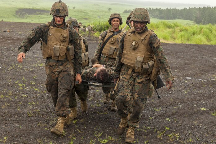 U.S. Marines with Fuels platoon and Headquarters and Service Company, Marine Wing Support Squadron (MWSS) 171 stationed at Marine Corps Air Station Iwakuni, Japan, carry a simulated casualty to an evacuation point while conducting company level training during exercise Eagle Wrath 2016 at Combined Arms Training Center Camp Fuji, July 21, 2016. MWSS-171 conducts this exercise once a year in order to train all the Marines within the squadron, enhance their technical skills, field experience and military occupational specialty capability. During this training, the company commanders have the opportunity to train their personnel and prepare for the final culminating event where Marines will construct and defend a landing zone and refueling point. (U.S. Marine Corps photo by Lance Cpl. Aaron Henson)
