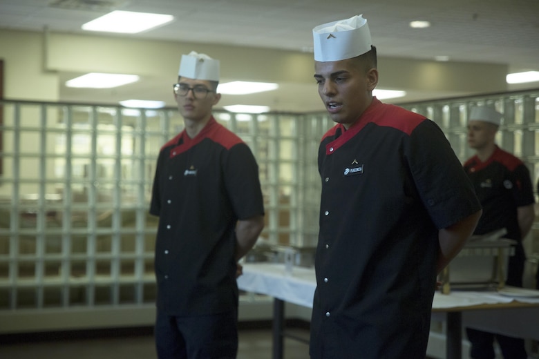 Pfc. Moises Plascencia, right, and Lance Cpl. Diego Ramirez, deliver an oral presentation during the Futenma Mess Hall Chef of the Month competition July 22 on Marine Corps Air Station Futenma, Okinawa, Japan. The monthly competition is an opportunity for the Marines who are performing well in the workplace and seeking opportunities to better themselves through merit boards and other events. During the competition, the contestants must plan a full multi-course meal, cook the dishes and serve it to a panel of judges who evaluate their meal based on taste, appearance, originality and the Marines’ oral presentations explaining each course. Ramirez and Plascencia are food service specialists assigned to the MCAS Futenma Mess Hall. Ramirez is a Baker’s Hill, California, native. Plascencia is a Modesto, California, native.