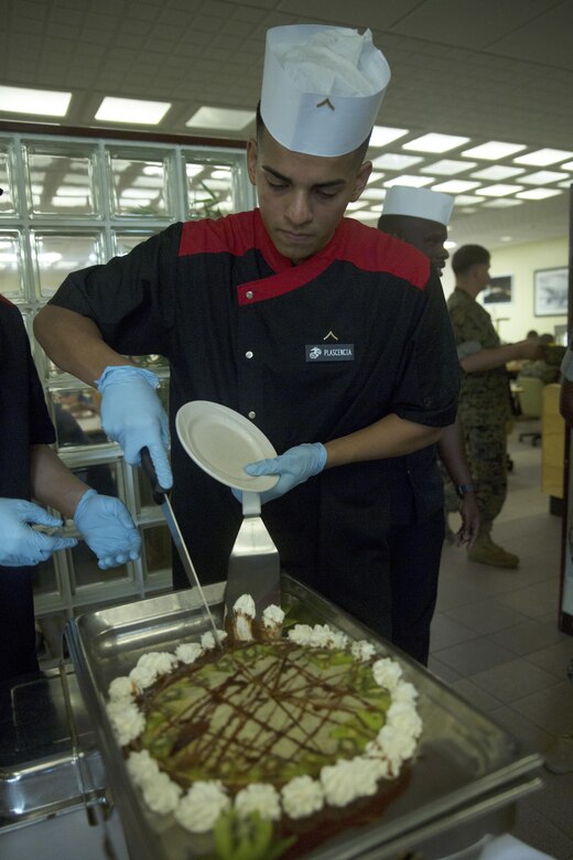 Pfc. Moises Plascencia prepares to serve a crepe cake during the Futenma Mess Hall Chef of the Month competition July 22 on Marine Corps Air Station Futenma, Okinawa, Japan. The monthly competition is an opportunity for the Marines who are performing well in the workplace and seeking opportunities to better themselves through merit boards and other events. During the competition, the contestants must plan a full multi-course meal, cook the dishes and serve it to a panel of judges who evaluate their meal based on taste, appearance, originality and the Marines’ oral presentations explaining each course. Plascencia is a food service specialist assigned to the MCAS Futenma Mess Hall and a Modesto, California, native.