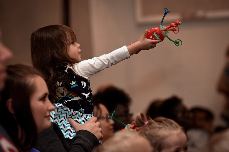 PETERSON AIR FORCE BASE, Colo. – Korra Phoung, 2, gestures at the furry characters during the Sesame Street USO Experience at the base auditorium on Peterson Air Force Base, Colo., July 22, 2016. The experience for military families debuted in 2008 and was designed to assist them with the unique challenges they face, such as moving. (U.S. Air Force photo by Senior Airman Rose Gudex)