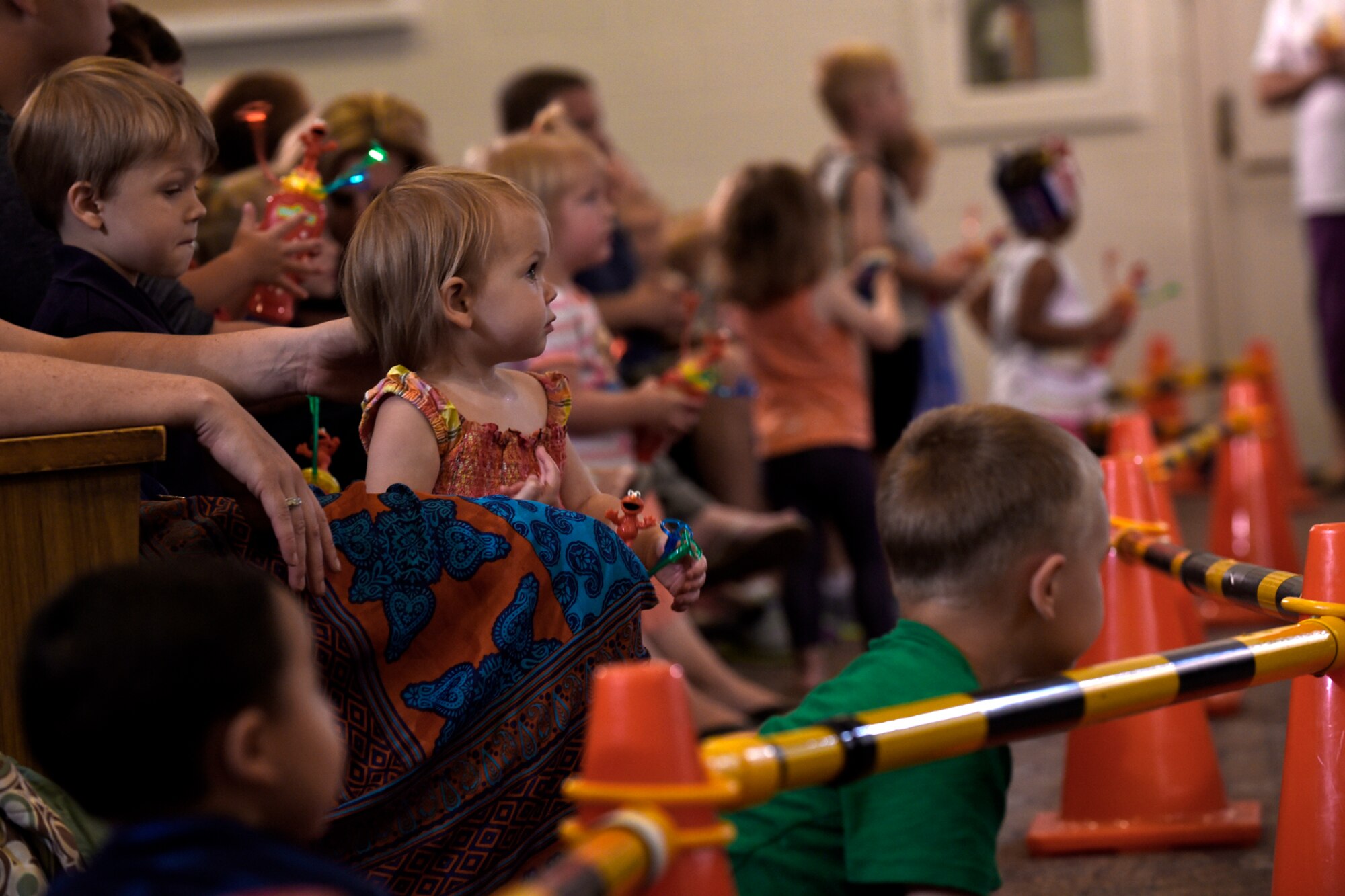 PETERSON AIR FORCE BASE, Colo. – Children of Peterson families wait to interact with the Sesame Street characters during the Sesame Street USO Experience at the base auditorium on Peterson Air Force Base, Colo., July 22, 2016. Since the tour’s debut in 2008, its message has been shared with more than 540,000 troops and military families at more than 1,000 shows. (U.S. Air Force photo by Senior Airman Rose Gudex)