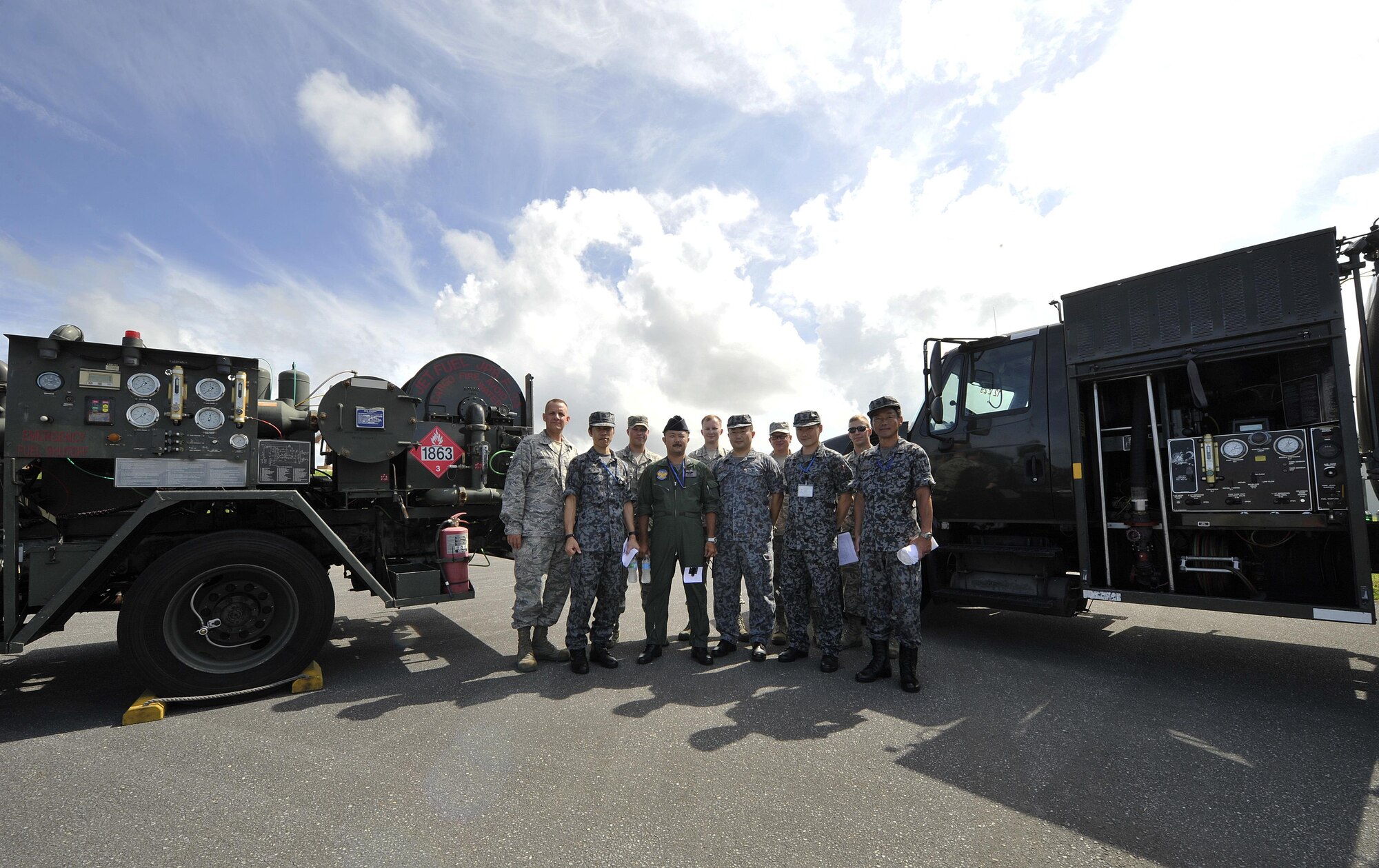 Japan Air Self Defense Force officers observe the 18th Logistics Readiness Squadron's facilities, July 21, 2016, at Kadena Air Base, Japan. The tour is an opportunity for professional networking throughout Okinawa's fuels community and also to share ideas on the most effective methods and equipment for delivering jet fuel. (U.S. Air Force photo by Naoto Anazawa)