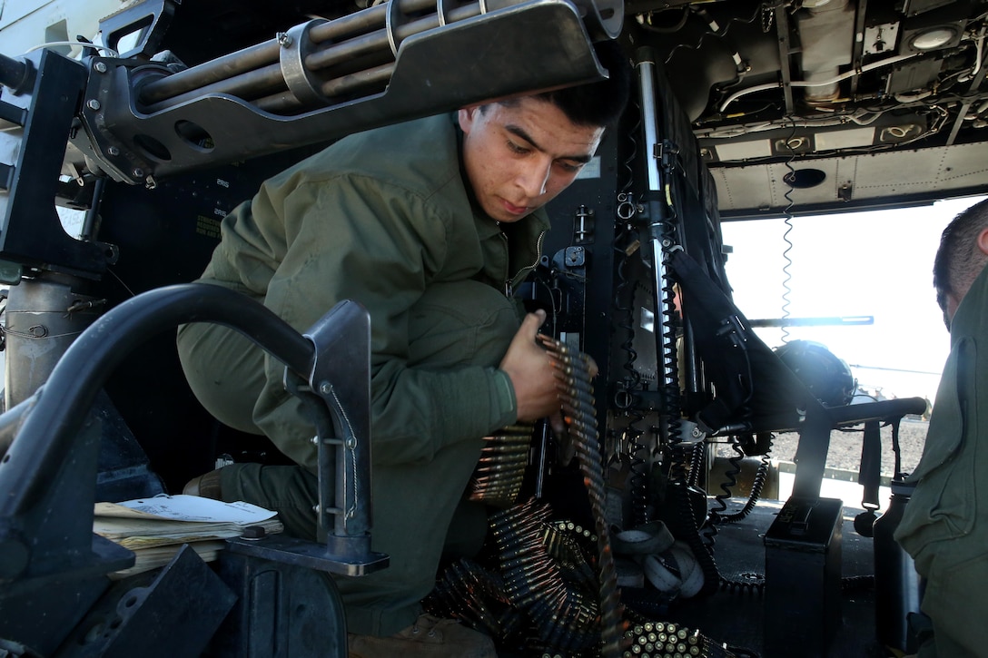 Lance Cpl. Anthony Loberg stages ammunition before a close air support exercise at Pohakuloa Training Area, Hawaii, July 19, 2016. Loberg is participating in Rim of the Pacific 2016, a multinational military exercise, from June 29 to Aug. 8 in and around the Hawaiian Islands. RIMPAC offers the U.S. military the opportunity to train with partners and allies in the Pacific region. Loberg, a native of Santa Maria, California, is a UH-1Y Huey crew chief with Marine Light Attack Helicopter Squadron 367, which supports III Marine Expeditionary Force. (U.S. Marine Corps Photo by Cpl. Natalie A. Dillon)