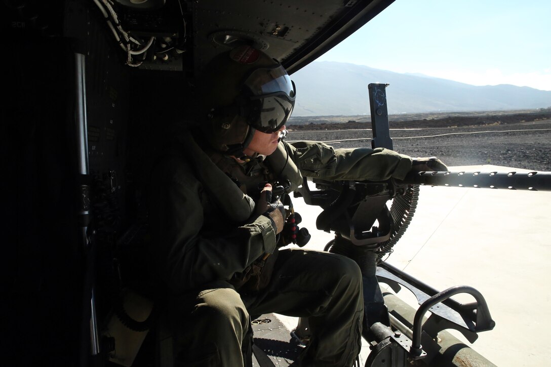 Cpl. Christopher Neumann prepares for takeoff in a UH-1Y Huey before a close air support exercise at Pohakuloa Training Area, Hawaii, July 19, 2016. Neumann is participating in Rim of the Pacific 2016, a multinational military exercise, from June 29 to Aug. 8 in and around the Hawaiian Islands. RIMPAC offers the U.S. military the opportunity to train with partners and allies in the Pacific region. Neumann, a native of Wells, Maine, is a UH-1Y Huey crew chief with Marine Light Attack Helicopter Squadron 367, which supports III Marine Expeditionary Force. (U.S. Marine Corps Photo by Cpl. Natalie A. Dillon)