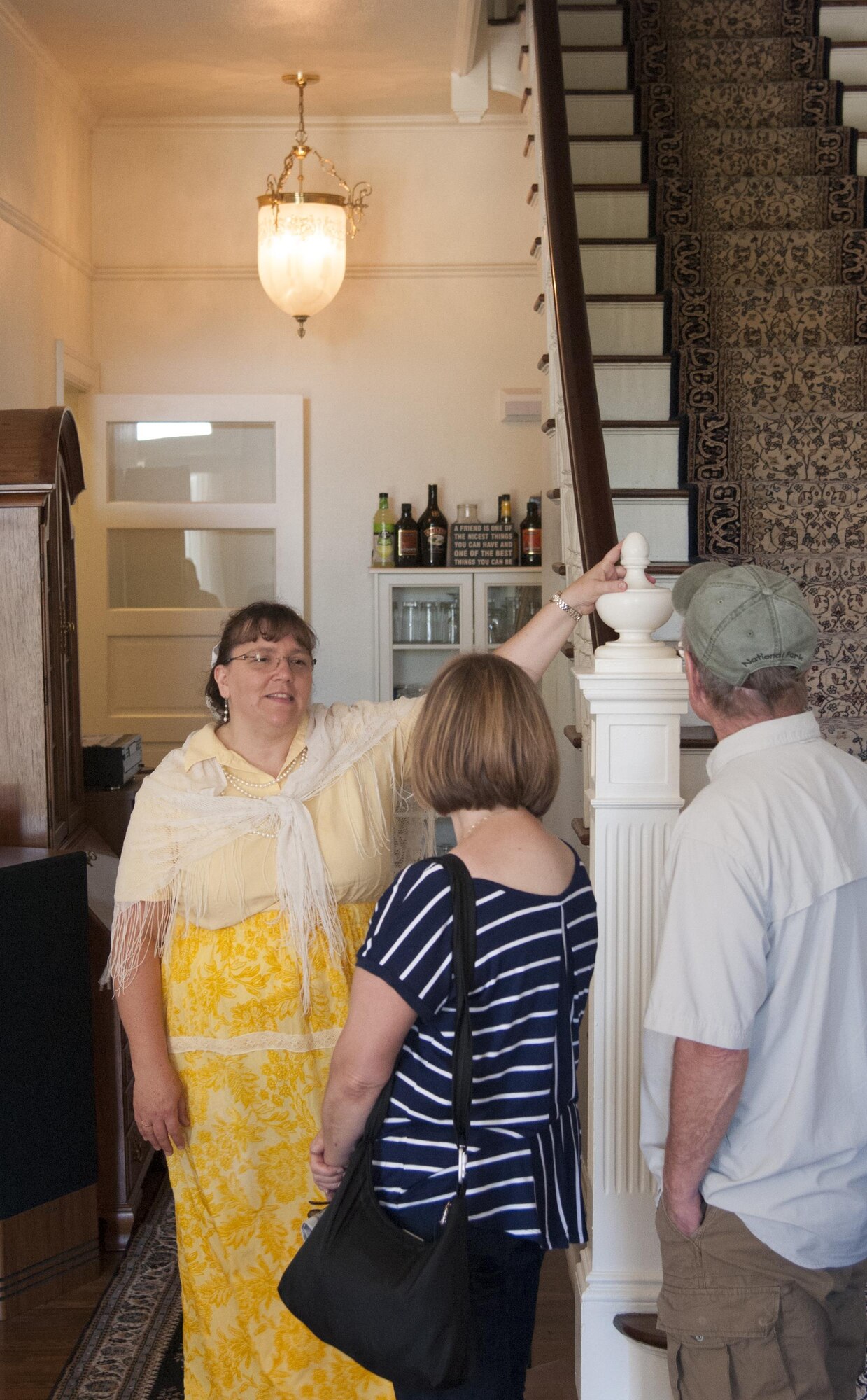 Jan Strickler, Warren Spouses Club member, explains the historic features of a home on F.E. Warren Air Force Base, Wyo., July 24, 2016, during the base's annual open house, Fort D.A. Russell Days. Each year, the base's housing contractor, Balfour Beatty Communities, teams up with the WSC to host a historic homes tour during the open house. (U.S. Air Force photo by Senior Airman Jason Wiese)
