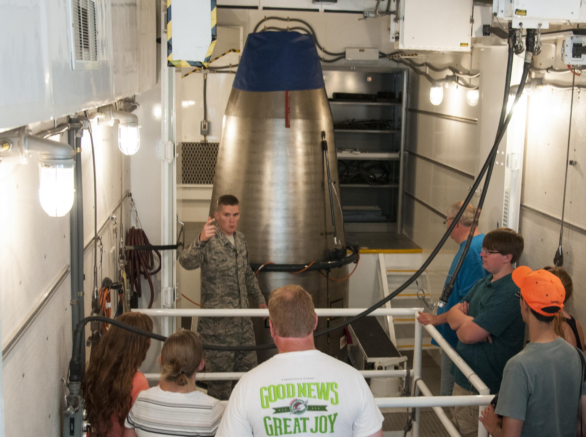 Senior Airman Gregory Gerst, 90th Missile Maintenance Squadron Missile Maintenance Team top sider, gives a group of visitors a tour of the inside of a payload transport July 24, 2016, during Fort D.A. Russell Days, the annual F.E. Warren Air Force Base, Wyo., open house. Payload transports carry Minuteman III Intercontinental Ballistic Missile components to and from the base and missile complex. (U.S. Air Force photo by Senior Airman Jason Wiese)