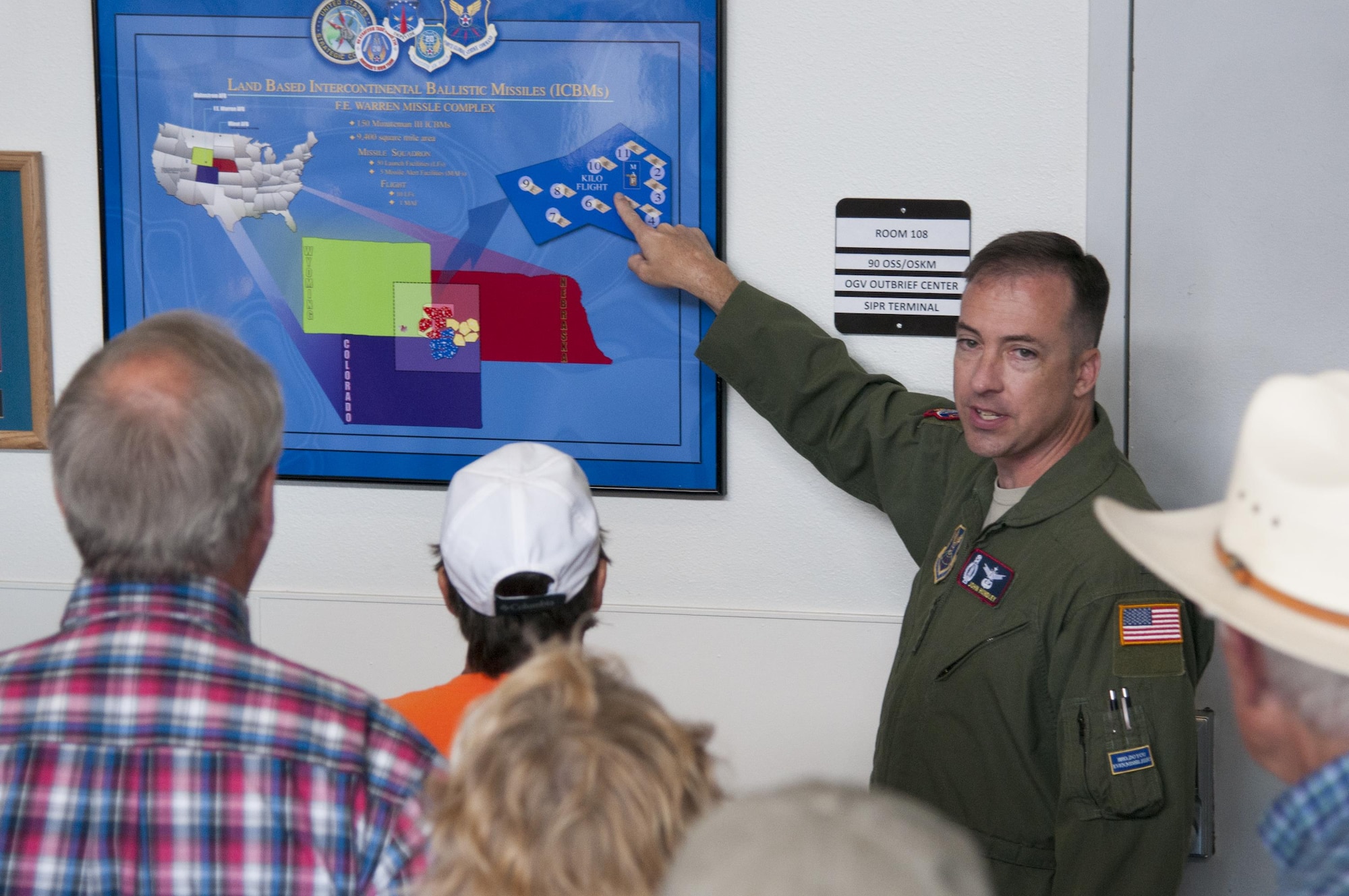 Lt. Col. John Hundley, 90th Operations Support Squadron commander, tells base visitors about the missile fleet of the 90th Missile Wing July 24, 2016, during Fort D.A. Russell Days, the annual F.E. Warren Air Force Base, Wyo., open house. Guests took free tours of the base to learn about the current mission. (U.S. Air Force photo by Senior Airman Jason Wiese)