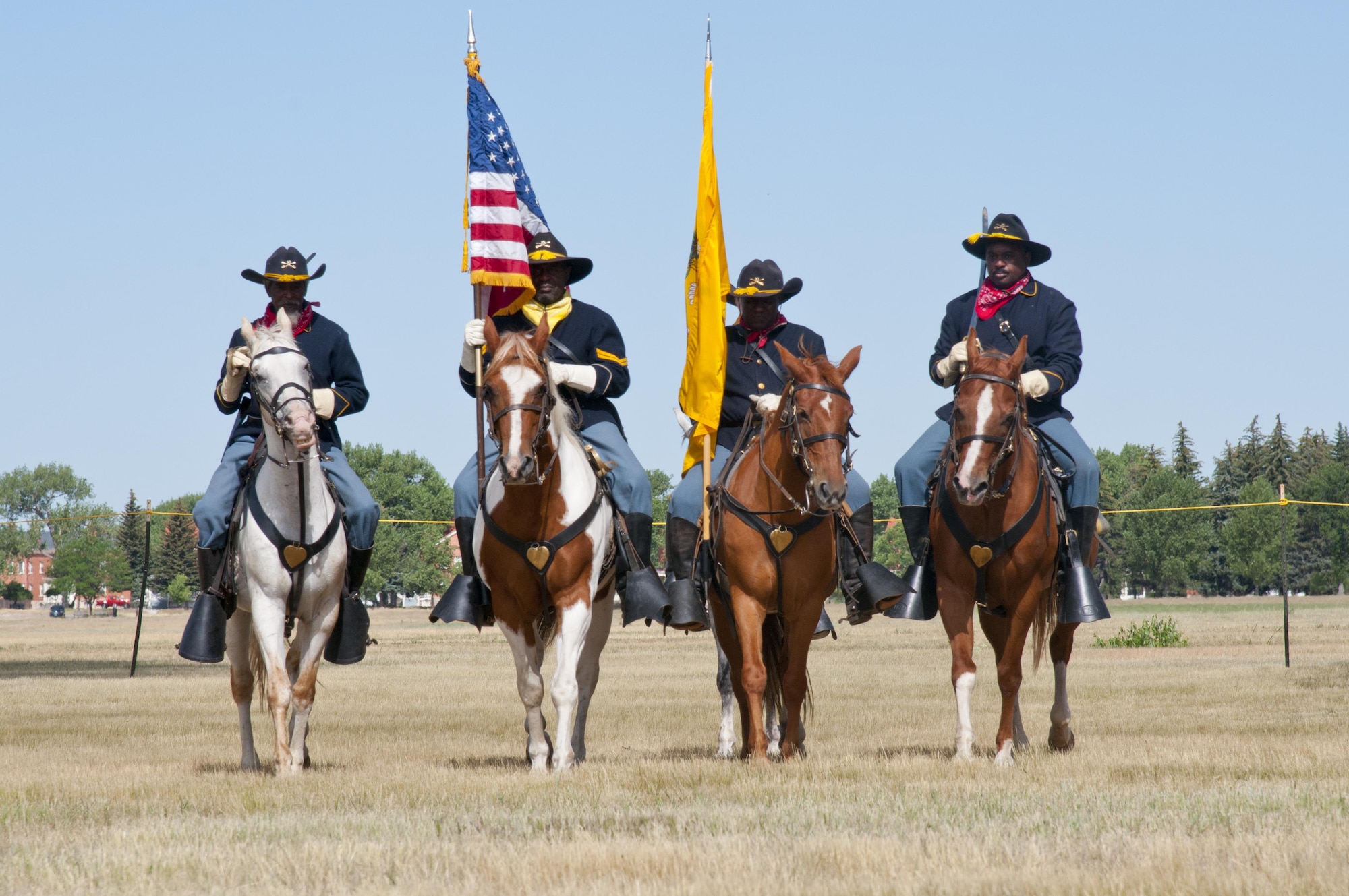 Buffalo Soldier re-enactors ride horses July 24, 2016, during Fort D.A. Russell Days, the annual F.E. Warren Air Force Base, Wyo., open house. The Buffalo Soldiers celebrate their 150th anniversary this year. (U.S. Air Force photo by Senior Airman Malcolm Mayfield)