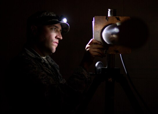 Capt. Brian Goodman, Flasher flight commander from 527th Space Aggressor Squadron at Schriever Air Force Base, Colorado, prepares an instrument before altering a fighter squadron's GPS system during exercise Red Flag at Nellis Air Force Base, Nevada, July 20, 2016.  (U.S. Air Force photo/Tech. Sgt. David Salanitri)