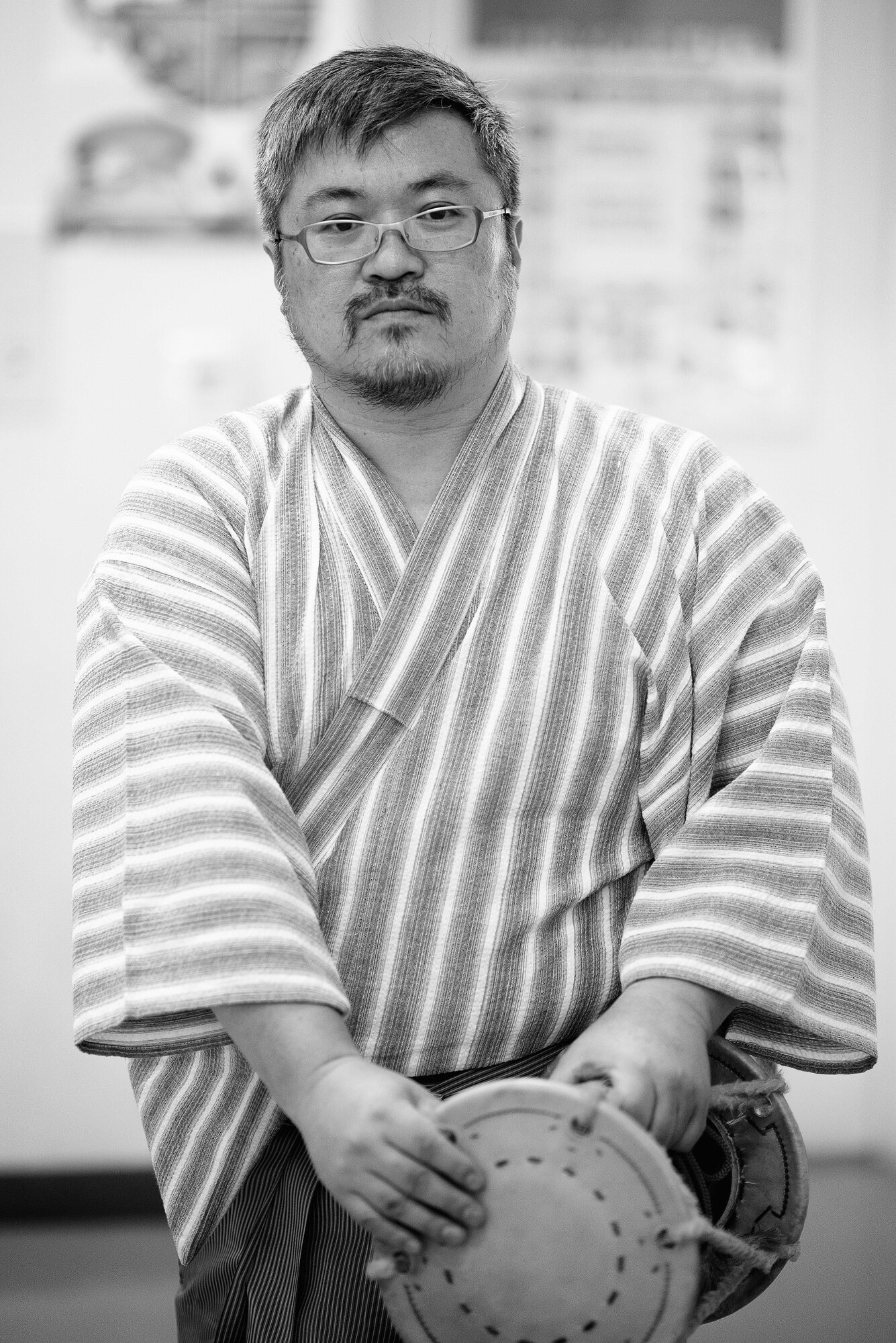 Kenji Ushimoto, Tsuzumi Do Group member, holds a tsuzumi drum at the middle school of Yokota Air Base, Japan, July 18, 2016. The playing of the tsuzumi drum is meant to demonstrate the harmony and unity between people and nature. (U.S. Air Force photo by Senior Airman Delano Scott/Released)