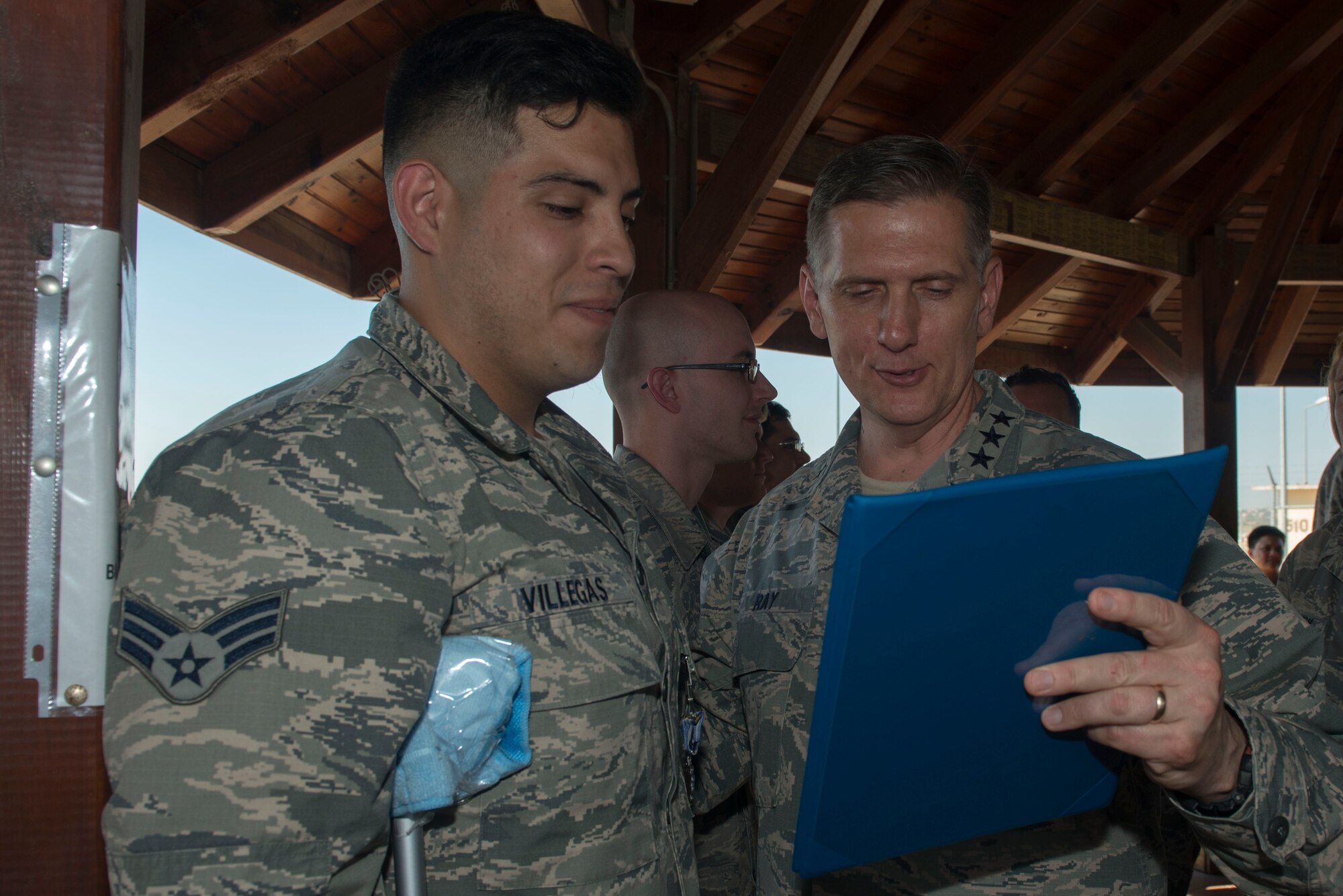 U.S. Air Force Lt. Gen. Timothy Ray, 3rd Air Force commander, presents a decoration to Senior Airman Carlos Villegas, 39th Operations Support Squadron air traffic controller, July 25, 2016, at Incirlik Air Base, Turkey. Ray visited the installation to meet with Airmen, observe operating conditions and recognize Airmen for their recent accomplishments. (U.S. Air Force photo by Senior Airman John Nieves Camacho)
