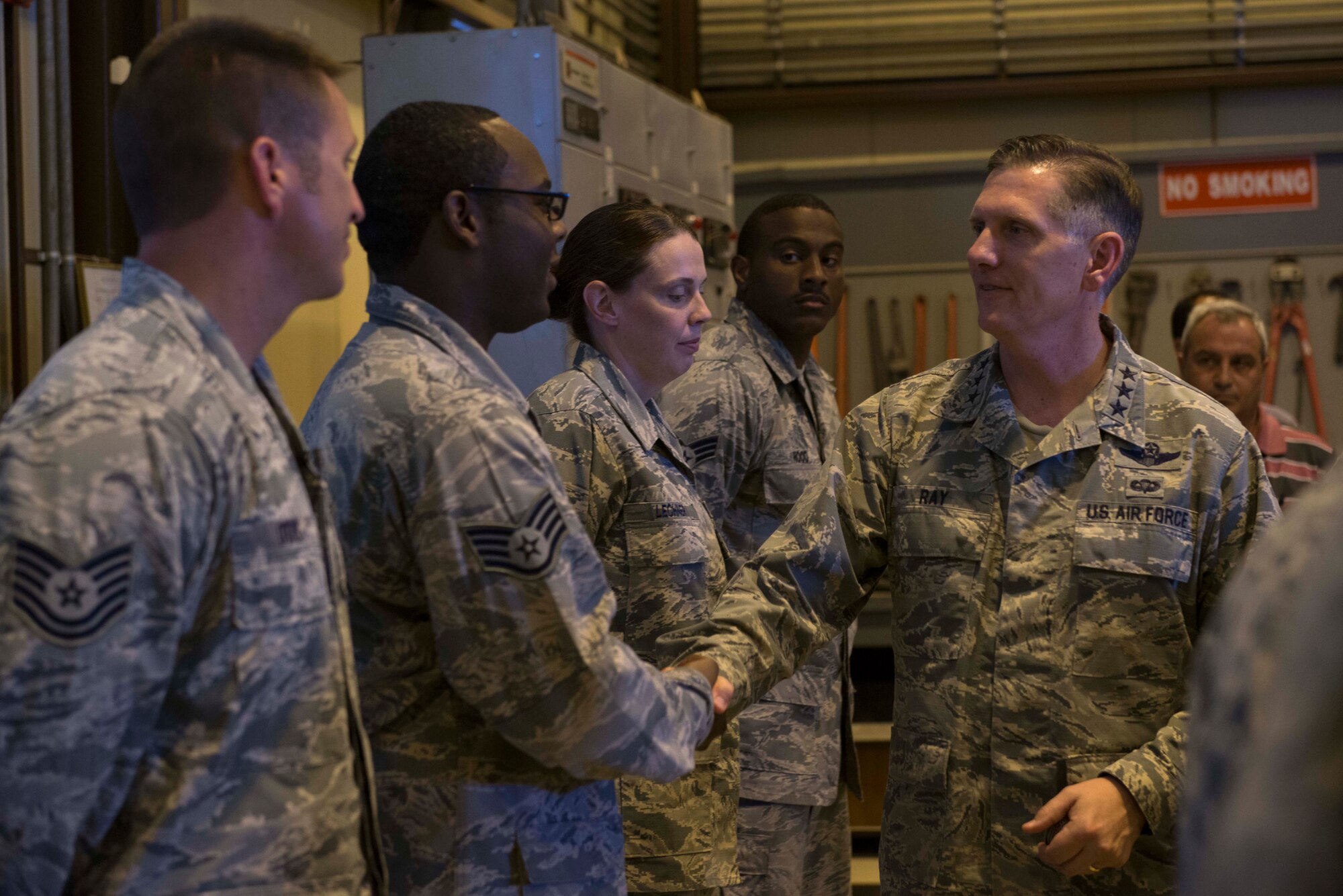 U.S. Air Force Lt. Gen. Timothy Ray, 3rd Air Force commander, coins Airmen in formation July 25, 2016, at Incirlik Air Base, Turkey. Ray visited the installation to meet with Airmen, observe operating conditions and recognize Airmen for their recent accomplishments. (U.S. Air Force photo by Senior Airman John Nieves Camacho)