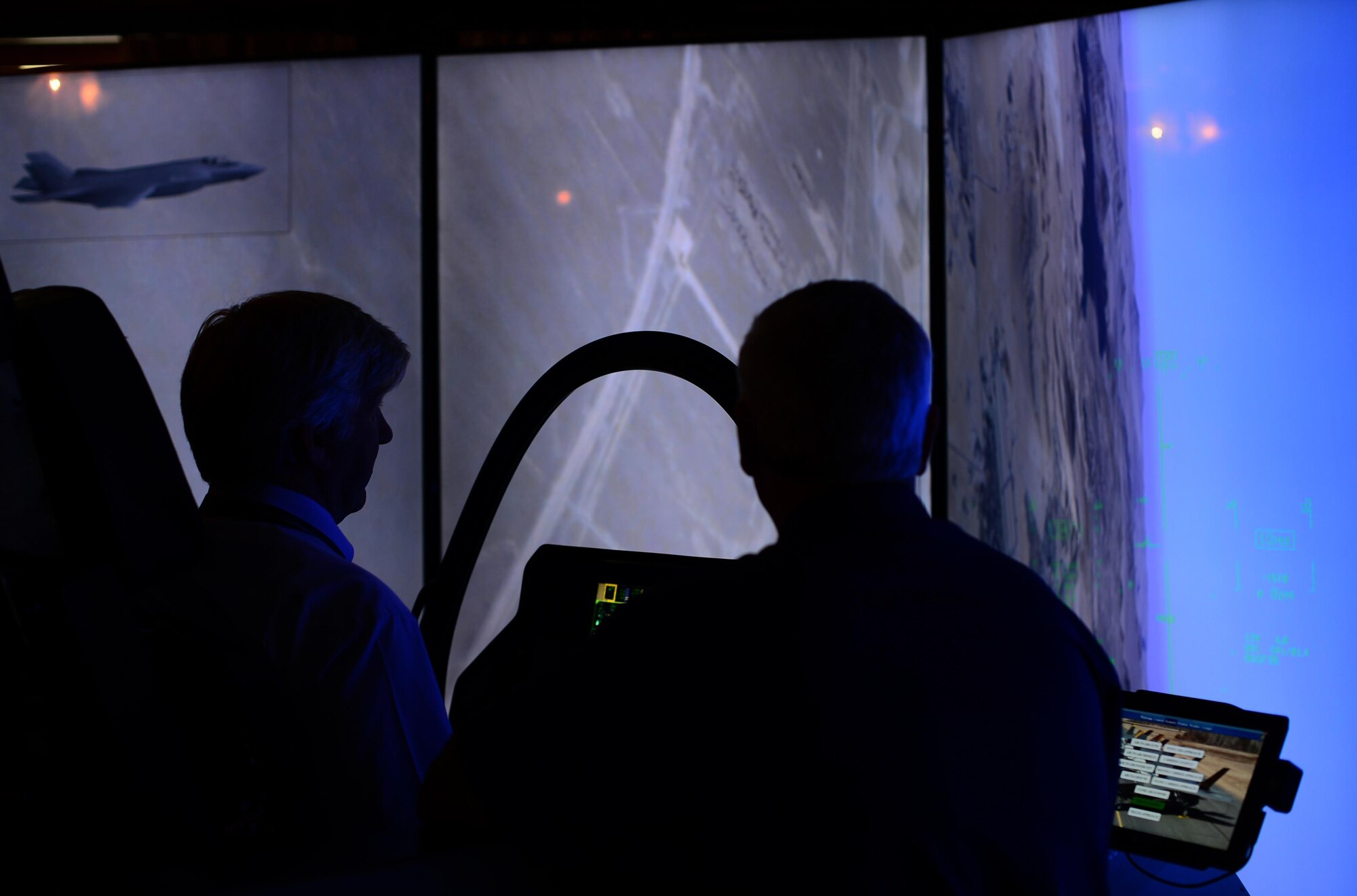 A visiting guest experiences a Lockheed Martin F-35 Lightning II Cockpit Demonstrator at Royal Air Force Lakenheath, England, July 21. Liberty Airmen from various units across the base were given the opportunity to utilize the simulator for a first-hand look at how the base’s future aircraft will operate. (U.S. Air Force photo/Senior Airman Erin Trower)